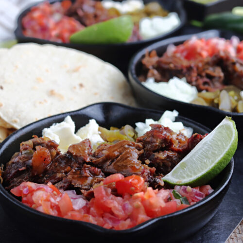 smoked barbacoa served with salsa, cheese and lime