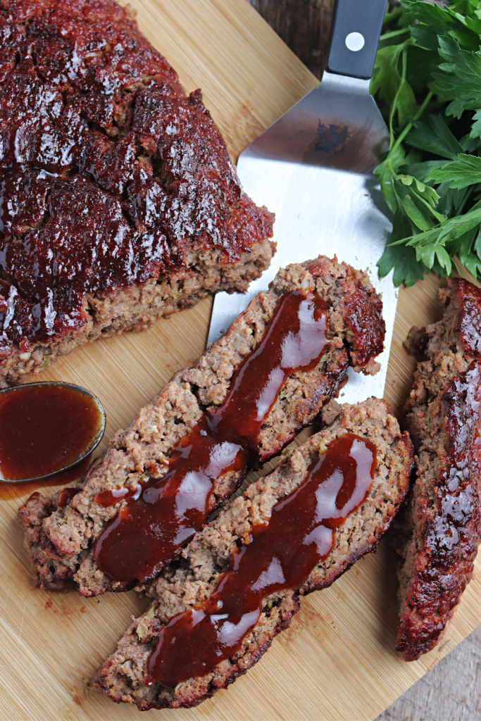 smoked meatloaf on cutting board with barbecue sauce