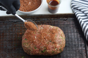 seasoning blend sprinkled on smoked meatloaf