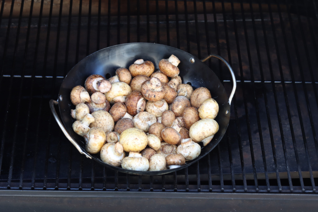 mushrooms in grill pan on Traeger smoker
