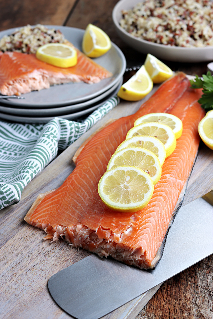 smoked salmon served on gray plate with lemon