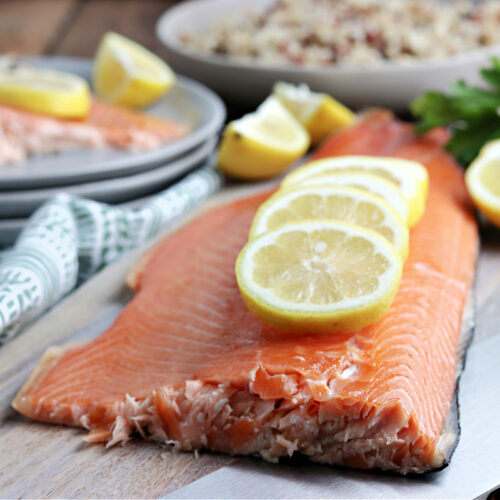 smoked salmon served on gray plate with lemon