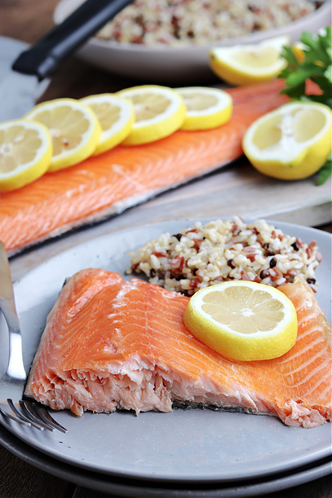 smoked salmon served on gray plate with lemon