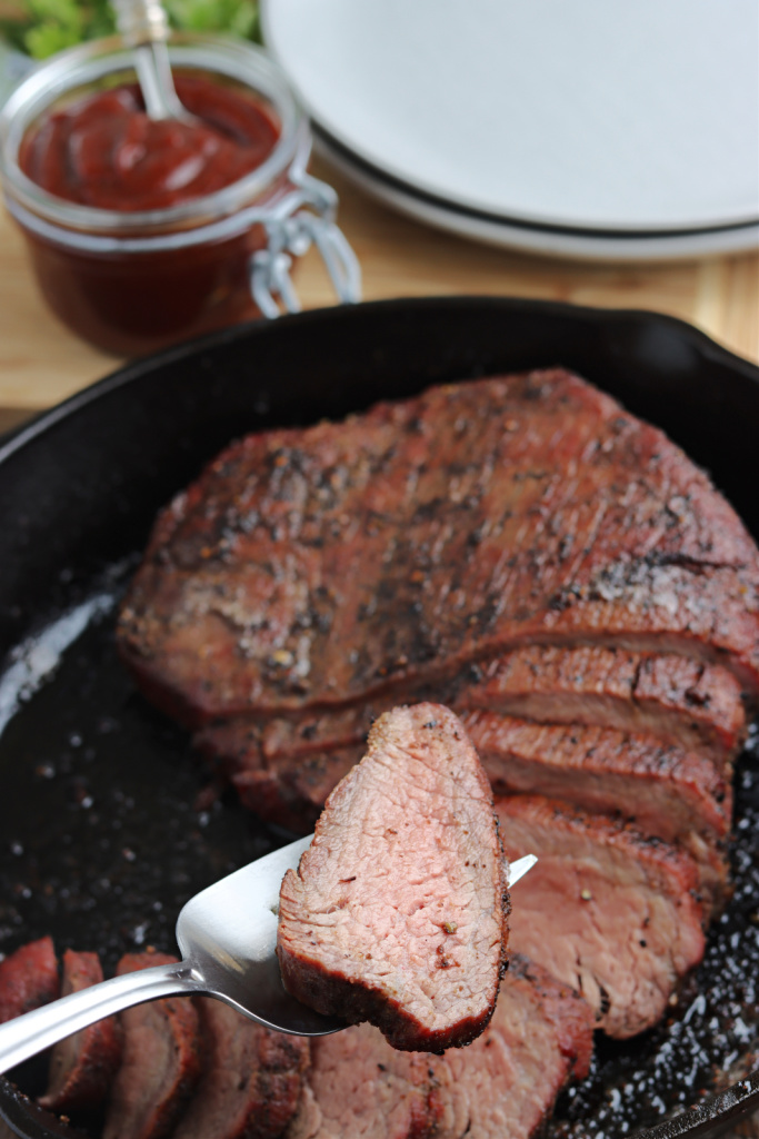 smoked tri tip in cast iron skillet and on fork