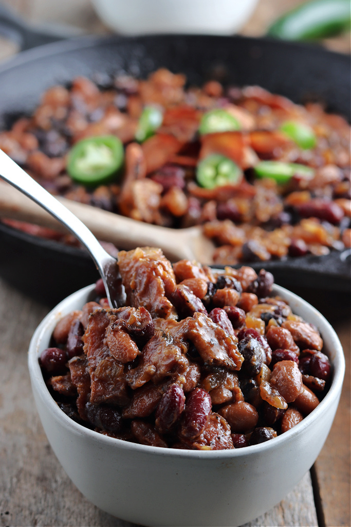 spoon in bowl of smoked baked beans