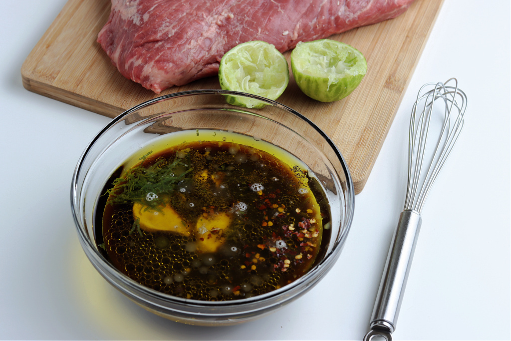 marinade for smoked flank steak in clear glass bowl