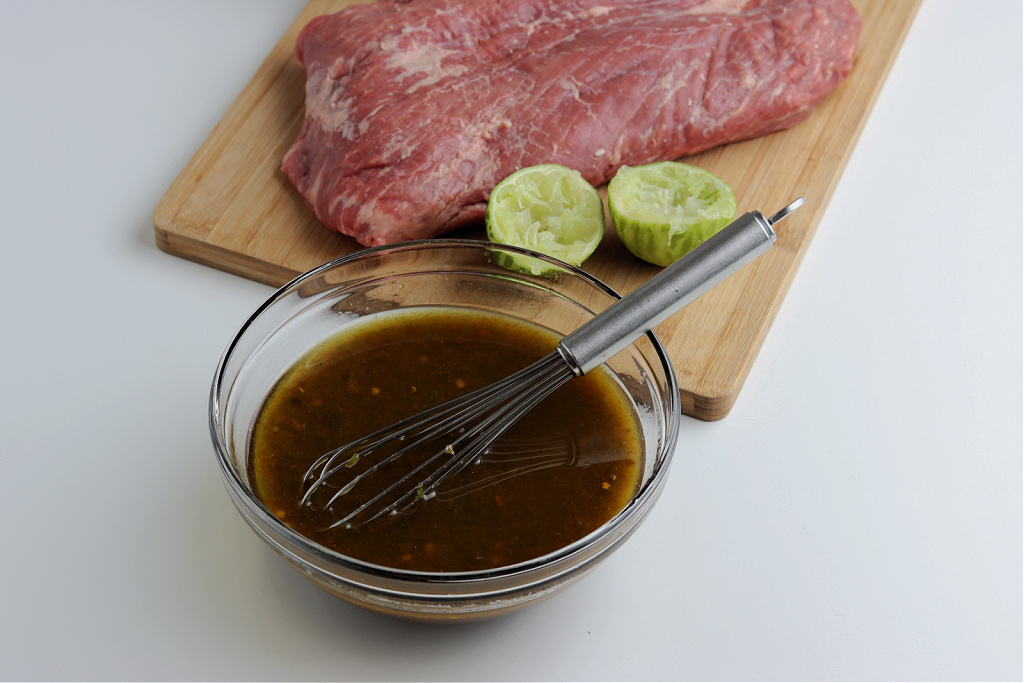 marinade mixed in clear glass bowl for smoked flank steak