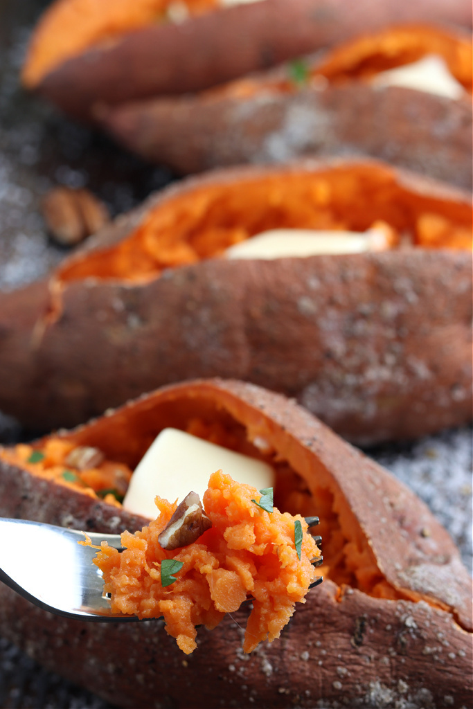 sweet potato on fork with pecan and parsley