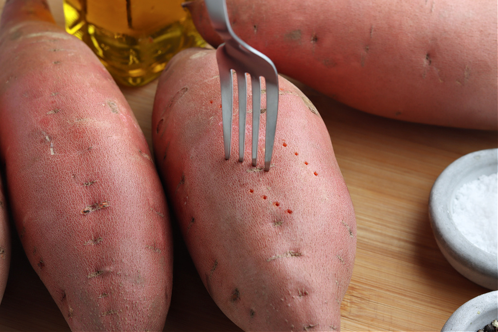 sweet potatoes poked with fork